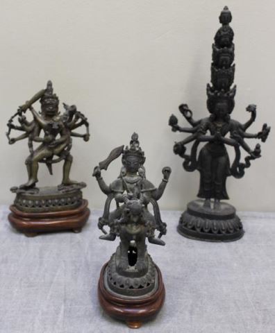 Appraisal: Group of Southeast Asian Bronze Deity Figures Two on wood