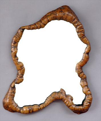 Appraisal: GNARLED ELM MIRROR The shaped plate within natural rootwood frame