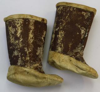 Appraisal: Northwest Coast miniature hide boots- length ht