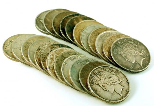 Appraisal: Twenty-three Peace silver dollars with dates Includes nine six five