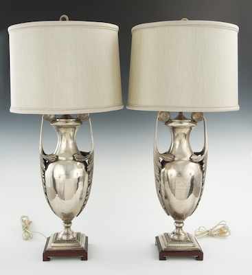 Appraisal: A Pair of Silver Metal Urn-Shape Lamps Each urn with