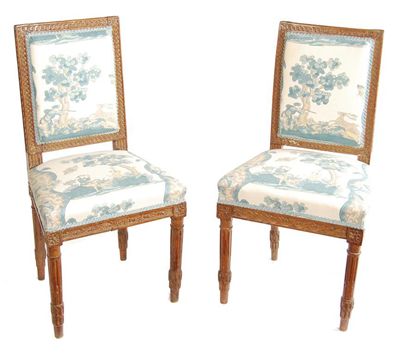 Appraisal: A pair of French carved beech wood side chairs the