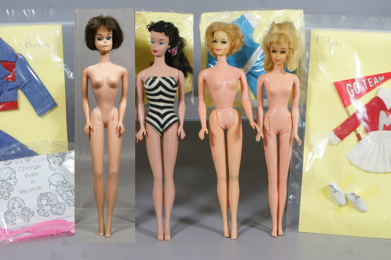 Appraisal: Barbie dolls by Mattel wearing black and white striped bathing