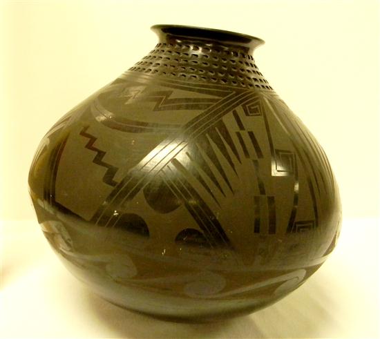 Appraisal: New Mexico style pottery jar black on black with carved