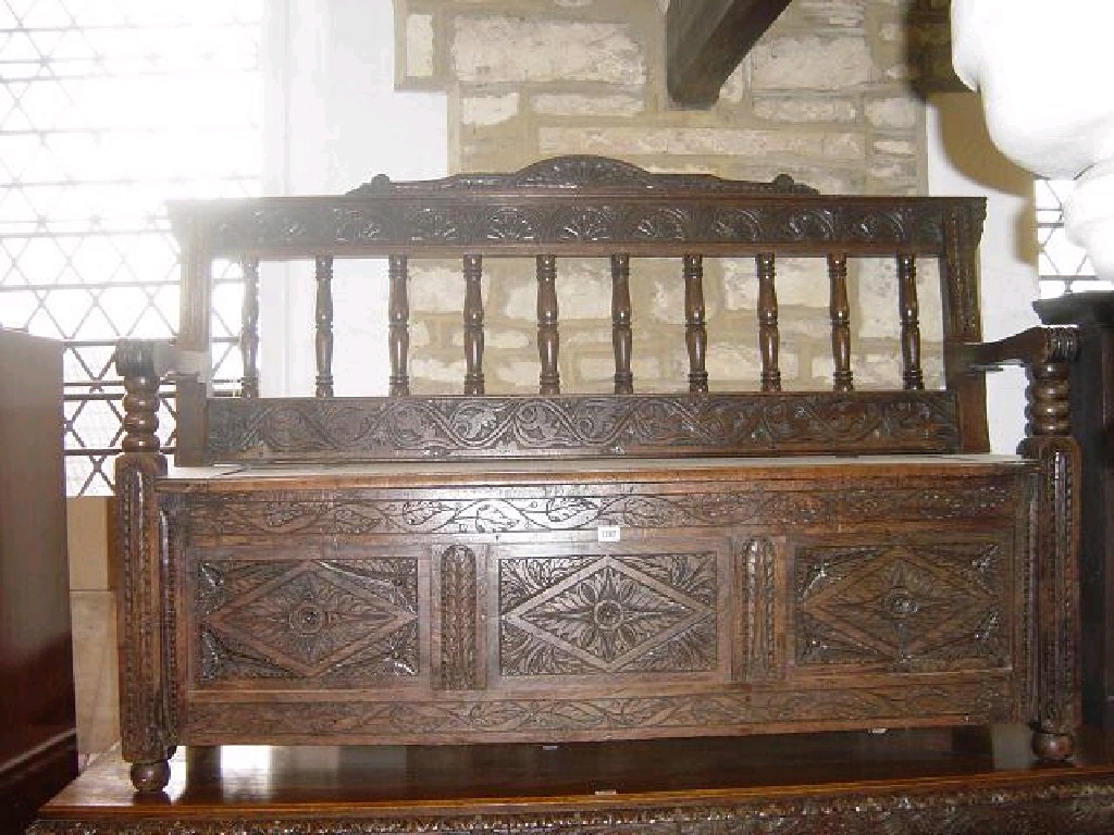 Appraisal: A Victorian carved oak settle with extensive carved and pierced