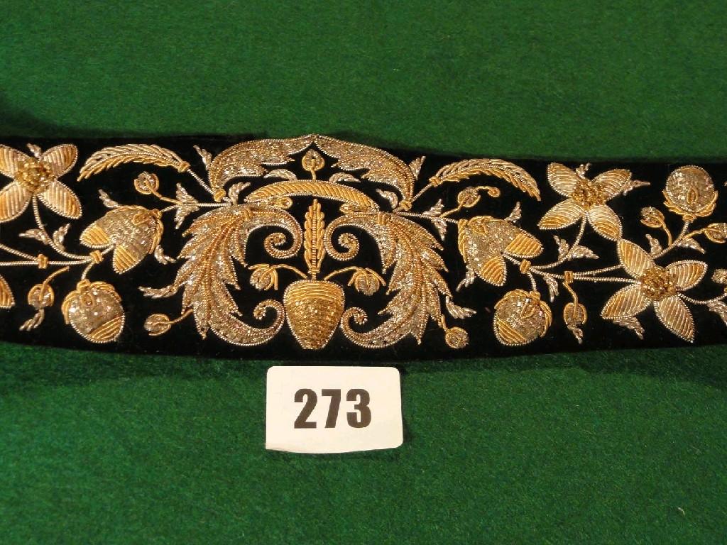 Appraisal: An Indian black velvet belt with ebonised decoration by Ganeshi