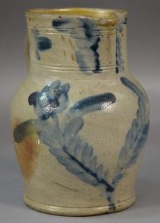 Appraisal: Stoneware batter pitcher with double cobalt blue flowers small chips