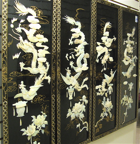 Appraisal: FOUR CHINESE BLACK LACQUERED WALL PANELS each having attached carved