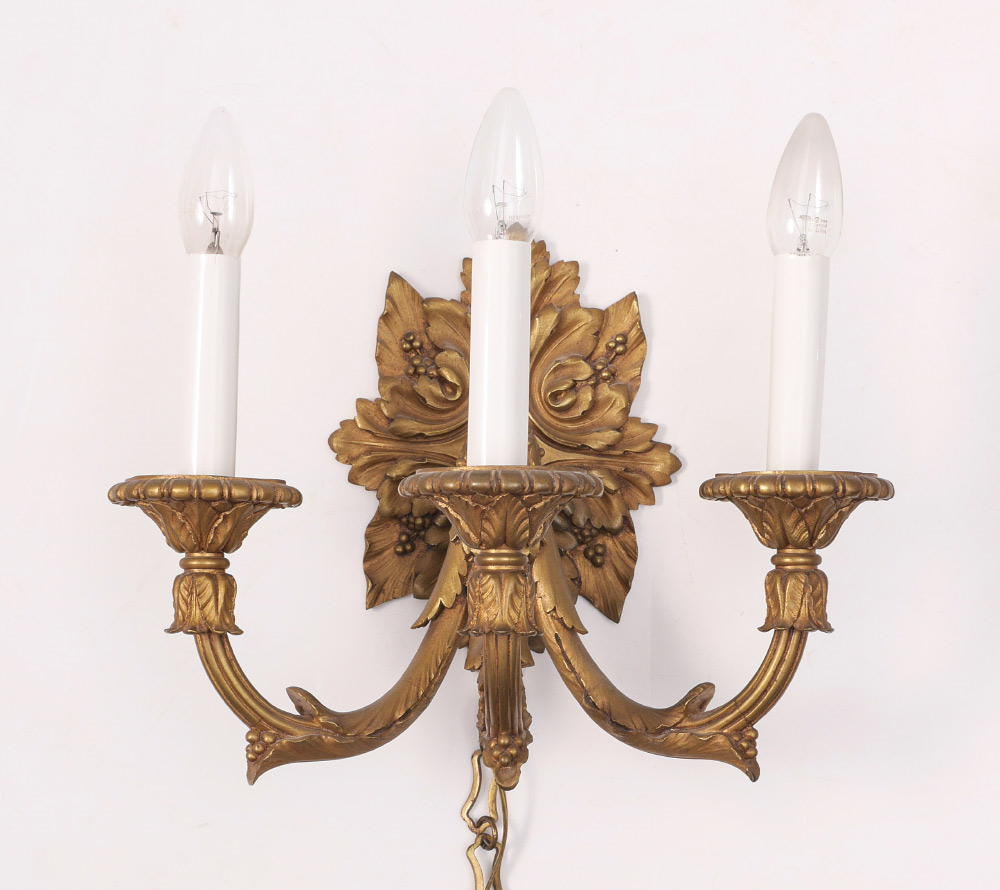 Appraisal: BRONZE FOLIATE MOTIF LIGHT WALL SCONCE Gold decorated cast bronze