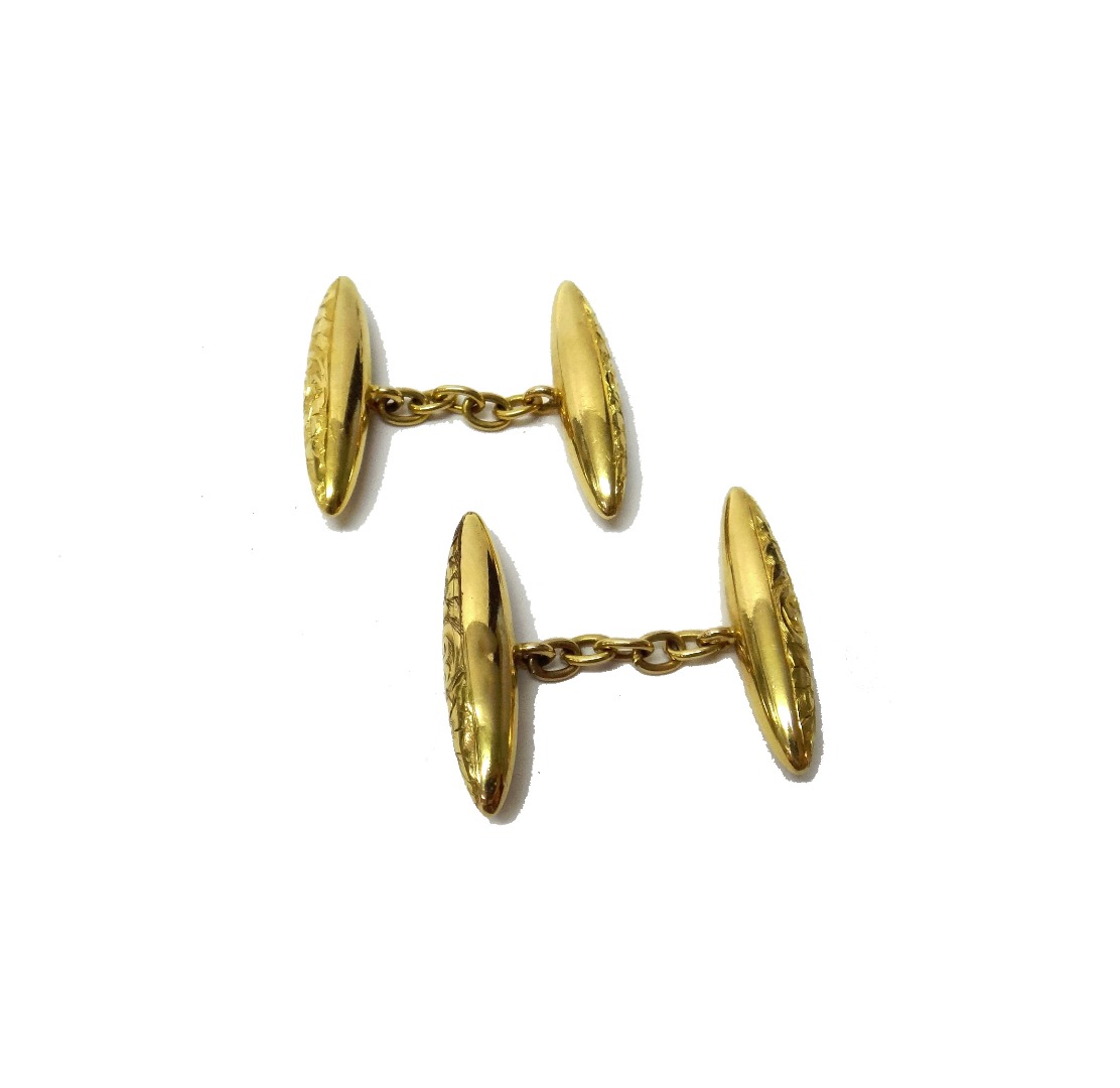 Appraisal: A pair of ct gold 'torpedo' cufflinks with engraved decoration