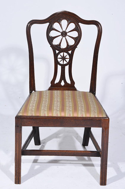 Appraisal: A GEORGE III MAHOGANY STANDARD CHAIR with carved roundel splat