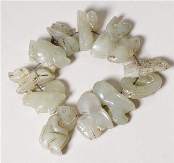 Appraisal: TWELVE CARVED JADE ANIMAL FIGURINES ON A STRING China L