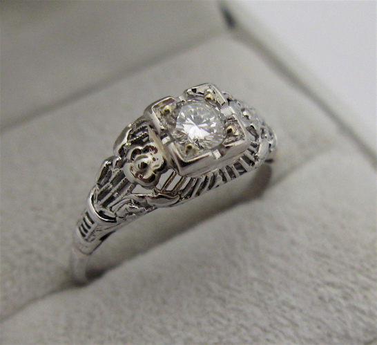 Appraisal: DIAMOND AND KARAT WHITE GOLD SOLITAIRE RING centering a round-cut