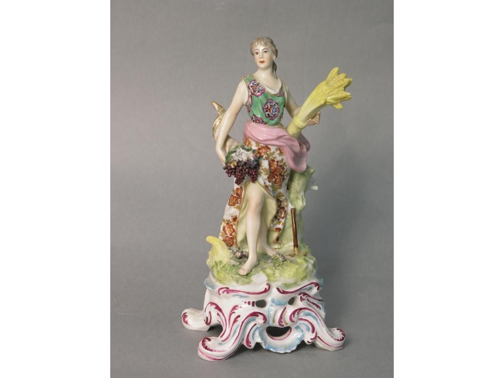 Appraisal: A th Century 'Chelsea' porcelain figure female holding wheatsheaf and