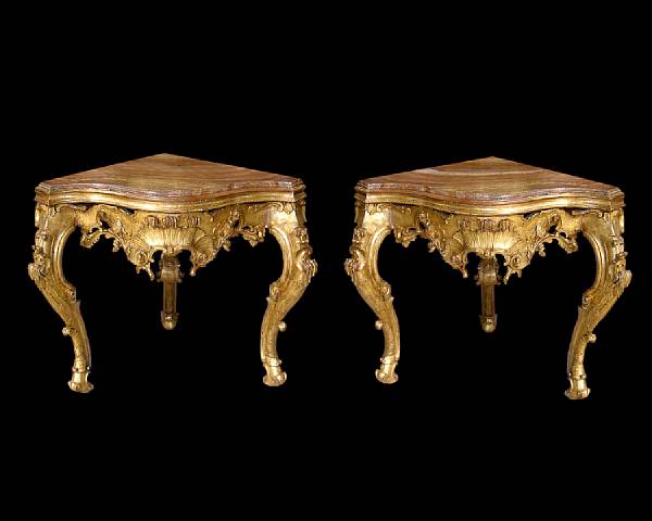 Appraisal: A bold pair of Italian Baroque giltwood corner console tables