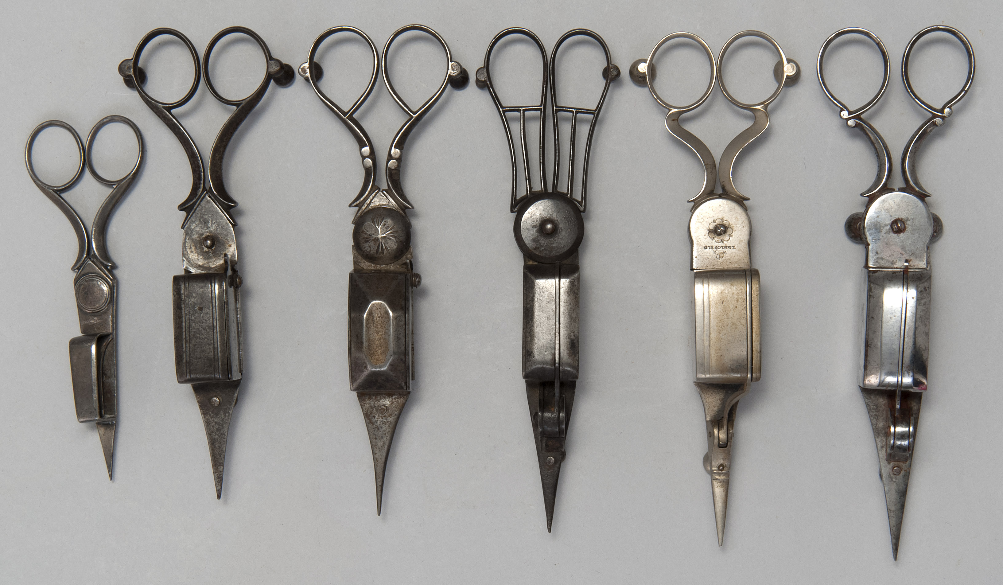 Appraisal: SIX CANDLE SNUFFERS Late th Early th CenturyIn steel and