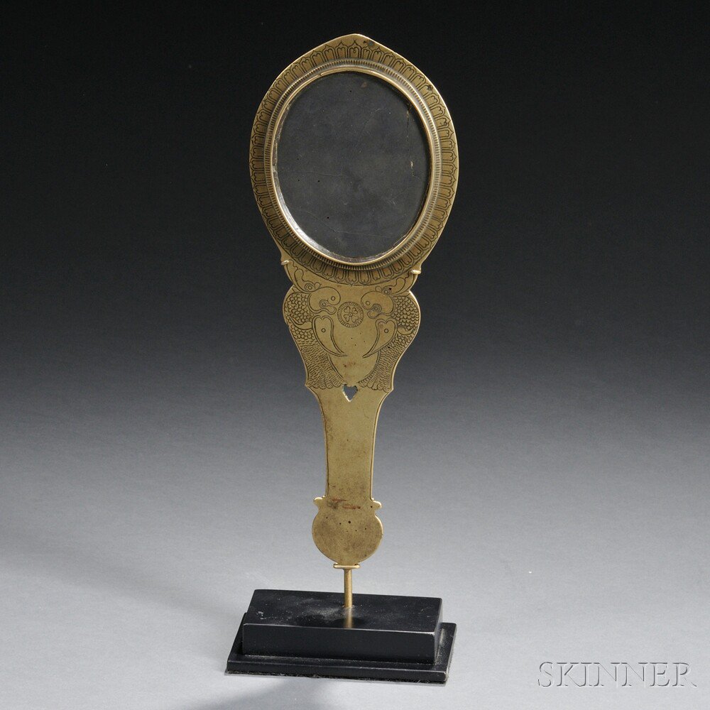 Appraisal: Brass Hand Mirror India oval meteoric iron mirror set in