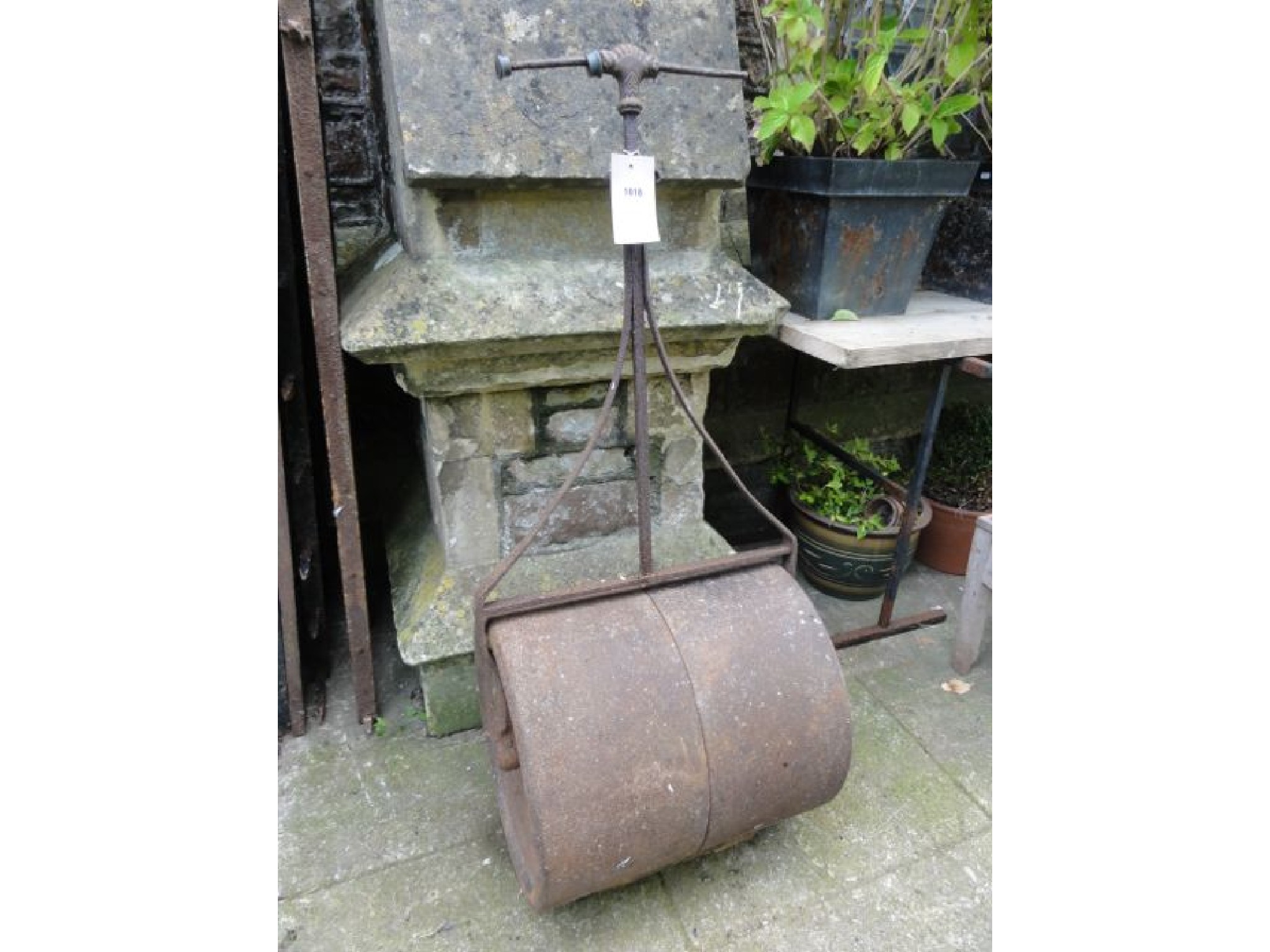 Appraisal: A th century cast iron garden roller stamped with raised