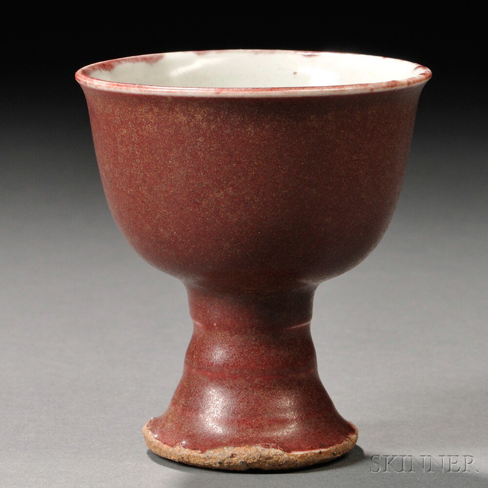 Appraisal: Ming-style Oxblood-glazed Stoneware Stem Cup China supported on a bamboo-form