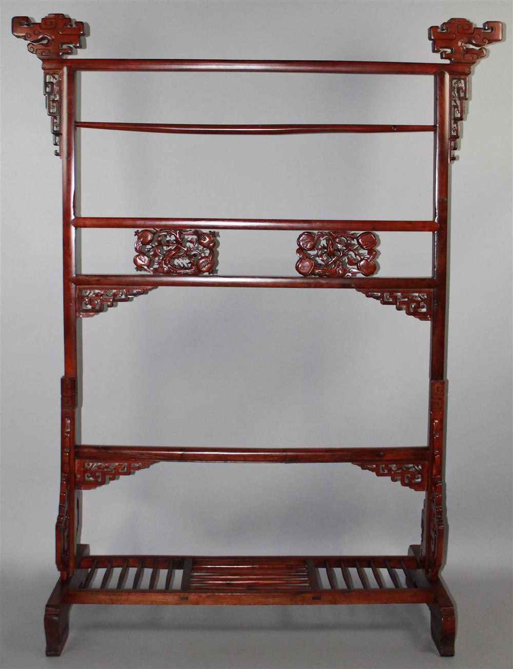 Appraisal: CHINESE CARVED HARDWOOD TOWEL RACK carved and incised finials above