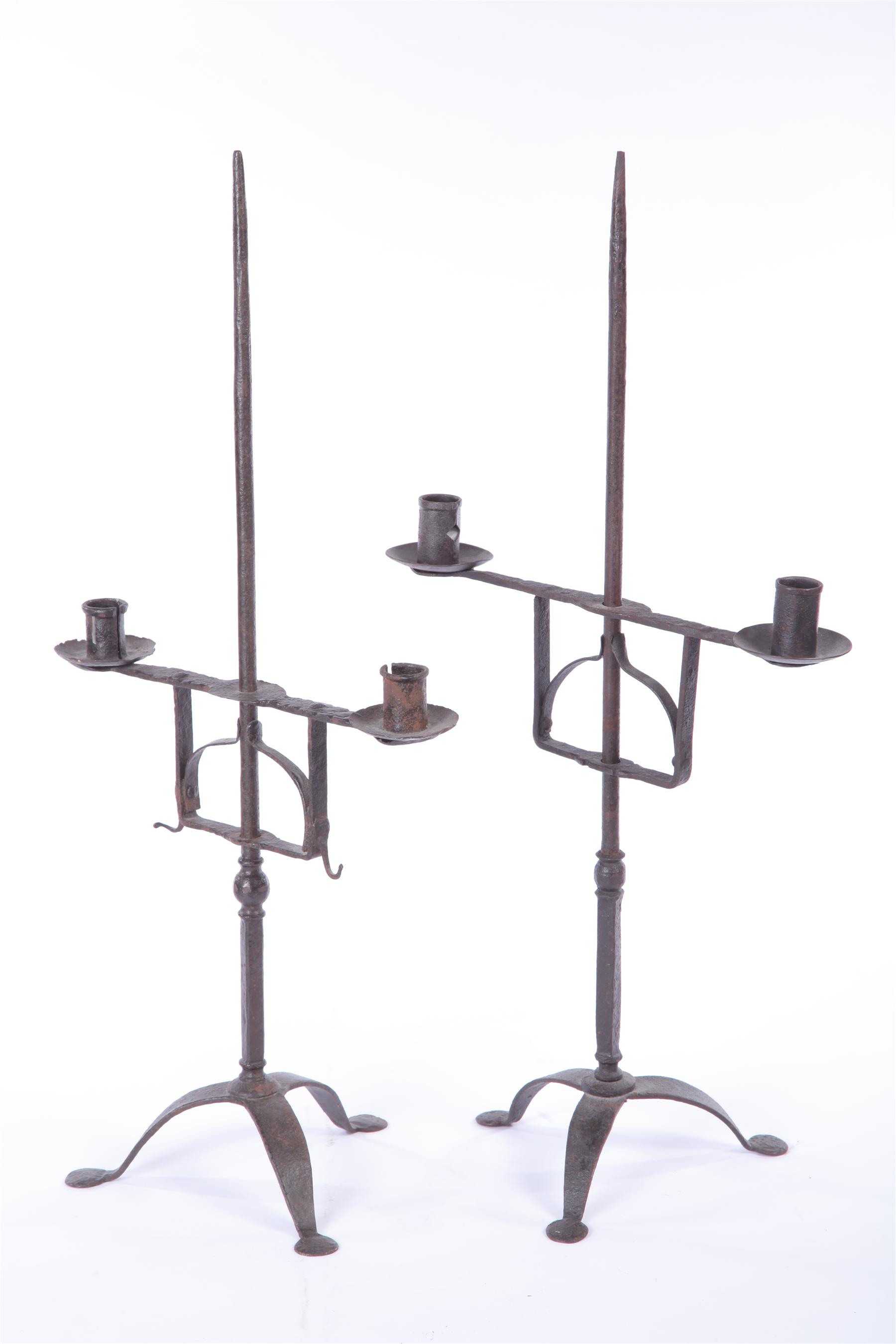 Appraisal: TWO WROUGHT IRON CANDLE HOLDERS American th century Similar with