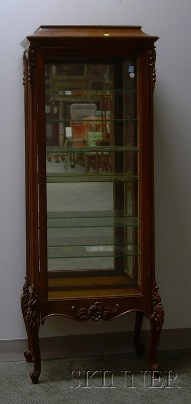 Appraisal: Louis XV Style Carved Mahogany Vitrine with mirrored back and