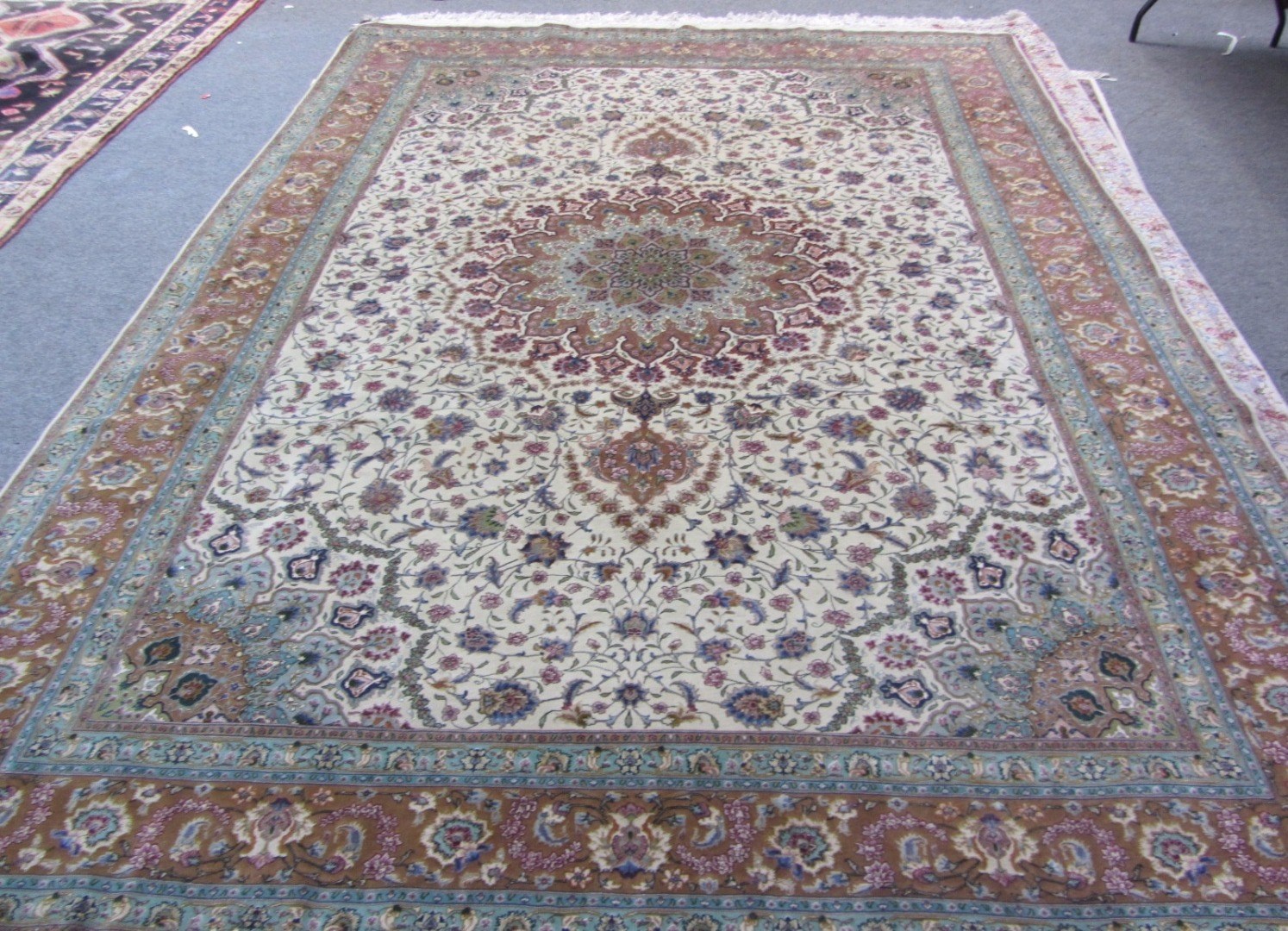 Appraisal: A part silk Tabriz carpet Persian the beige field with