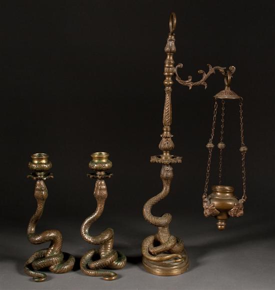 Appraisal: Pair of Continental patinated bronze python-form candlesticks and similar hanging