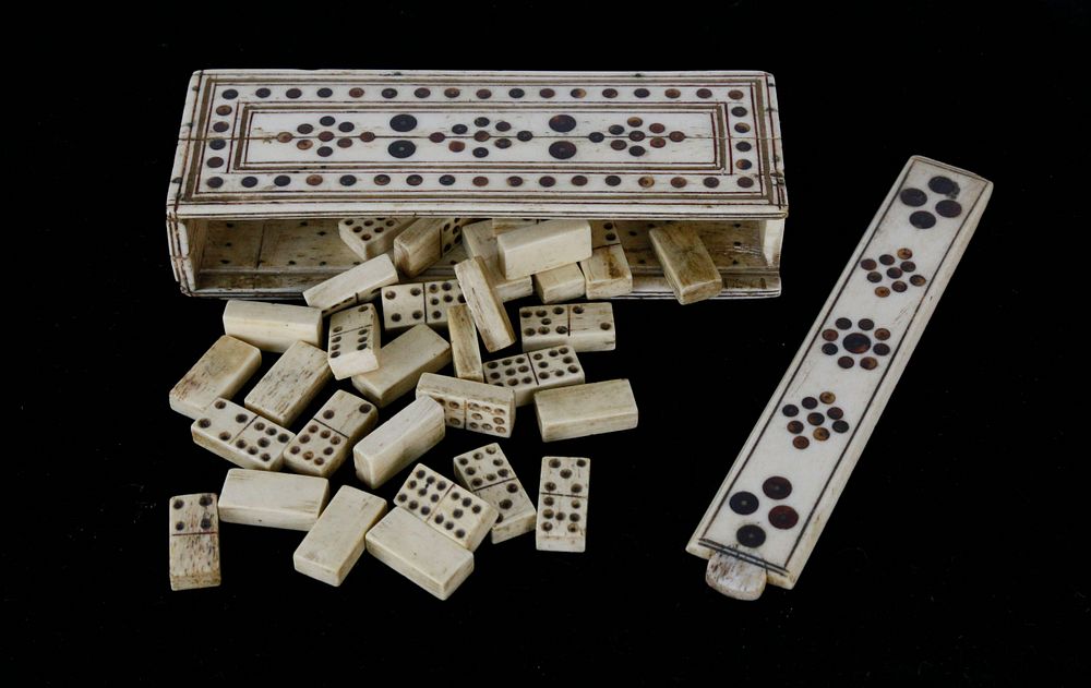 Appraisal: Prisoner of War Carved Bone Domino Set in Box circa