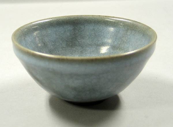 Appraisal: A Jun style glazed stoneware tea bowl Of inverted bell