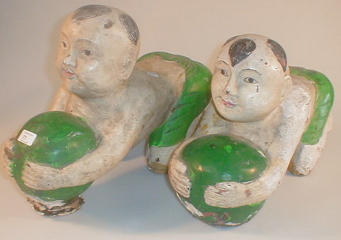 Appraisal: A pair of Chinese painted wood figures modelled as kneeling