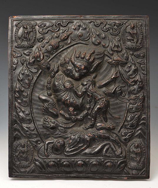 Appraisal: AN INDIAN RECTANGULAR PRESSED METAL PLAQUE depicting a deity high