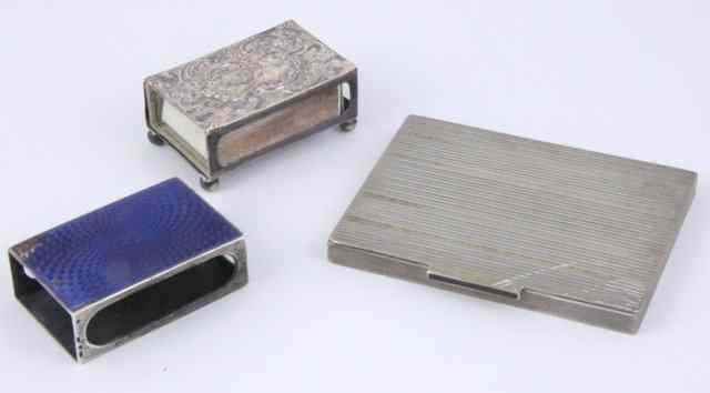 Appraisal: An embossed silver matchbox holder Birmingham another with blue guilloch