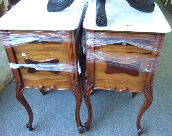 Appraisal: A pair of French mahogany bedside cupboards each with a