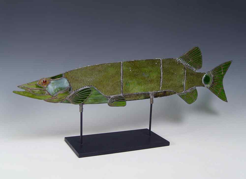 Appraisal: FIGURAL STAINED GLASS FISH ON STAND Leaded green glass fish