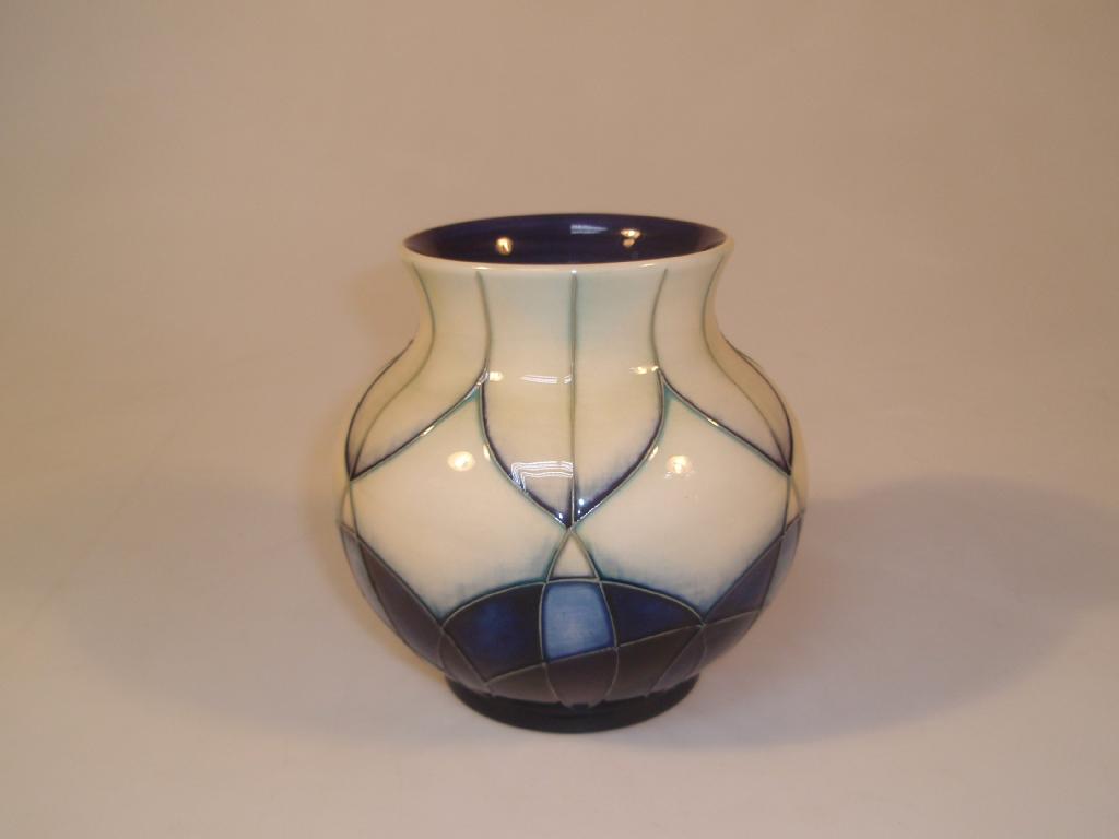 Appraisal: Moorcroft Modern a squat baluster vase decorated in shaded blue