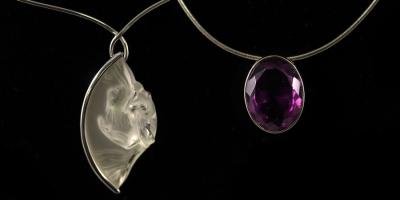 Appraisal: A Lalique 'Acrobate' pendant necklace set in silver boxed and