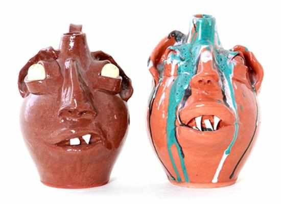 Appraisal: M L Owens stoneware face jugs North Carolina one clear