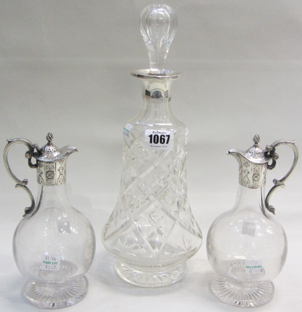 Appraisal: A silver mounted faceted glass bell shaped decanter Sheffield and