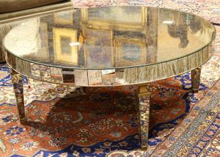 Appraisal: Hollywood Regency style mirrored low table Hollywood Regency style mirrored