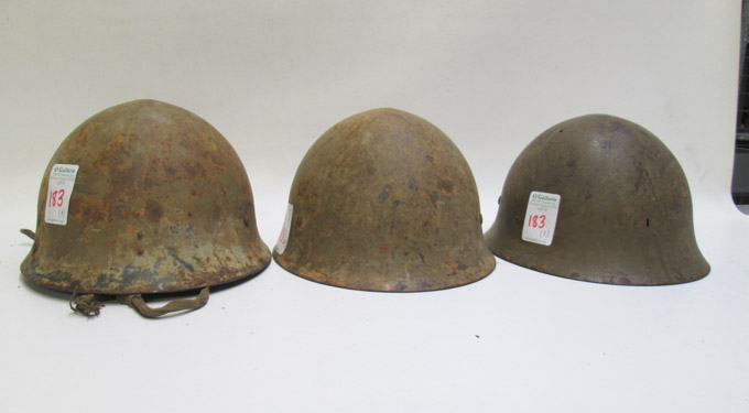 Appraisal: THREE WORLD WAR TWO JAPANESE ARMY HELMETS all with drab