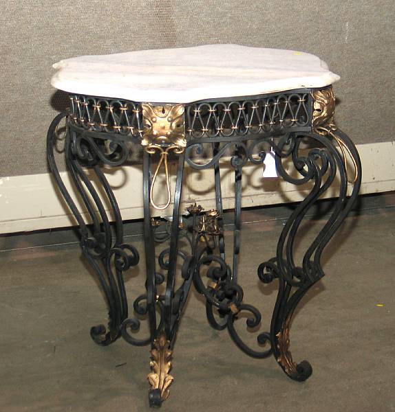 Appraisal: A pair of Rococo style parcel gilt wrought iron tables