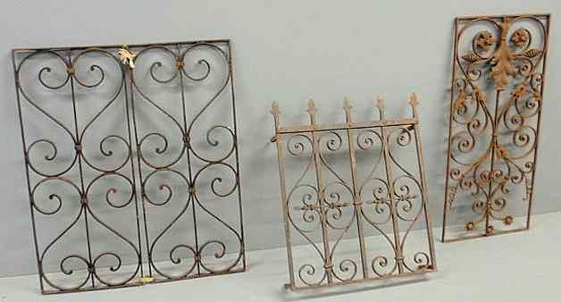 Appraisal: Pair of wrought iron window grates x and two other