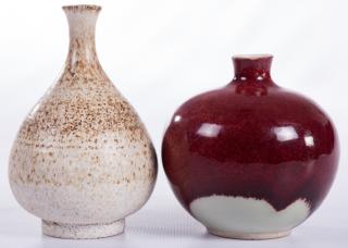 Appraisal: Handcrafted Pottery Bud Vases Two handcrafted bud vases to include