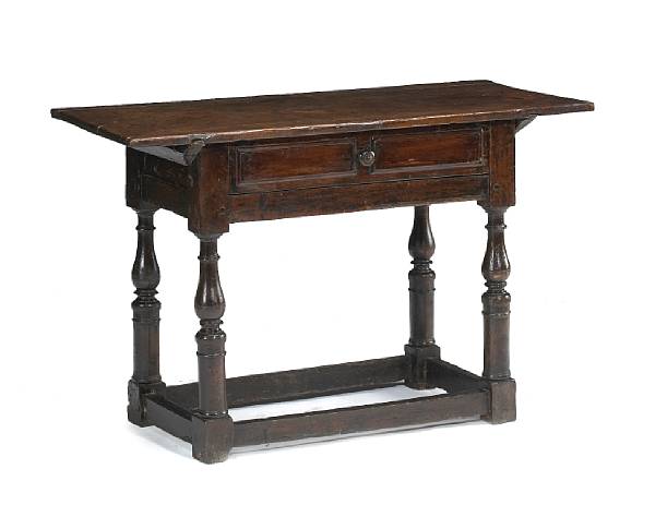 Appraisal: A Continental Baroque walnut table The rectangular top over a