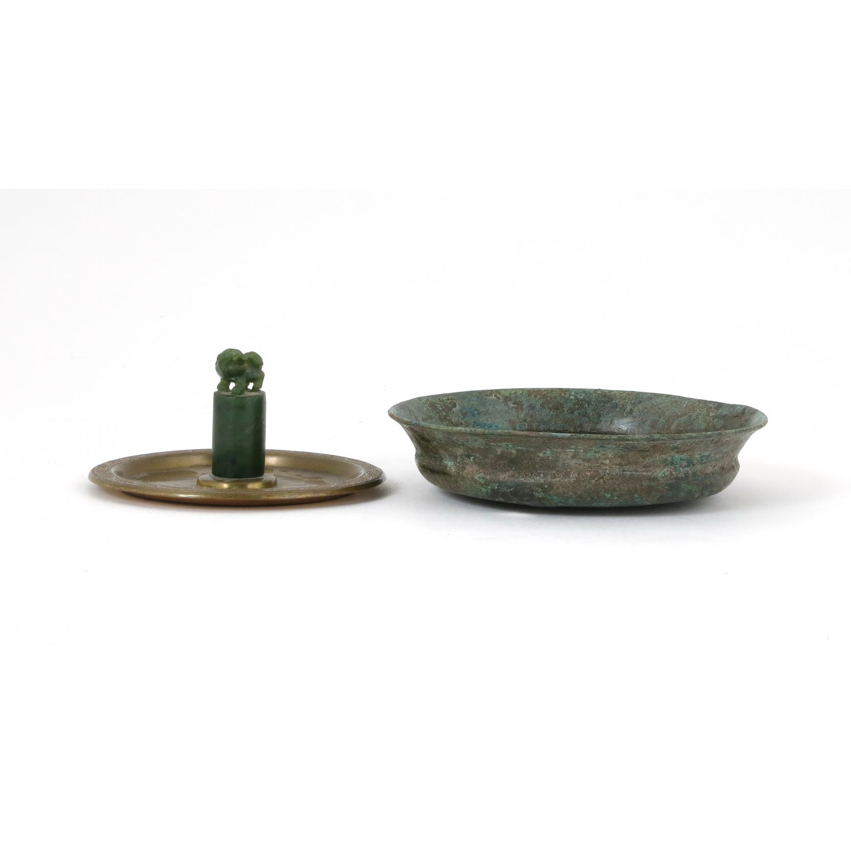 Appraisal: Two Chinese Objects the first a brass disc with central