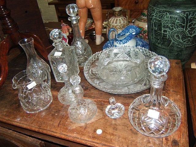 Appraisal: A collection of five cut glass decanters together with further