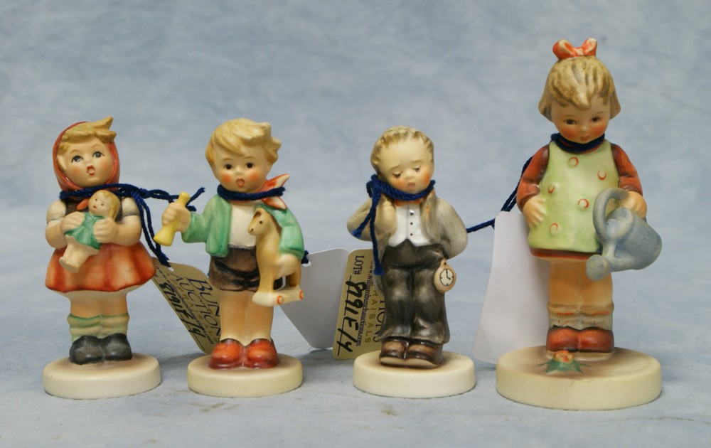 Appraisal: Goebel Hummel figurines Little Gardener Hum Girl with Doll Hum