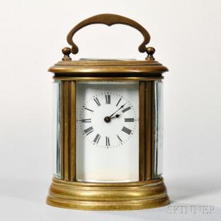 Appraisal: French Miniature Oval Carriage Clock c oval brass and beveled