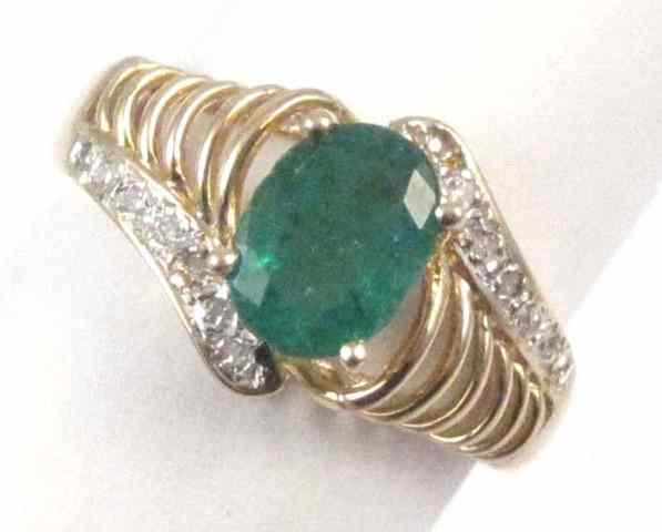 Appraisal: EMERALD DIAMOND AND FOURTEEN KARAT GOLD RING set with round-cut